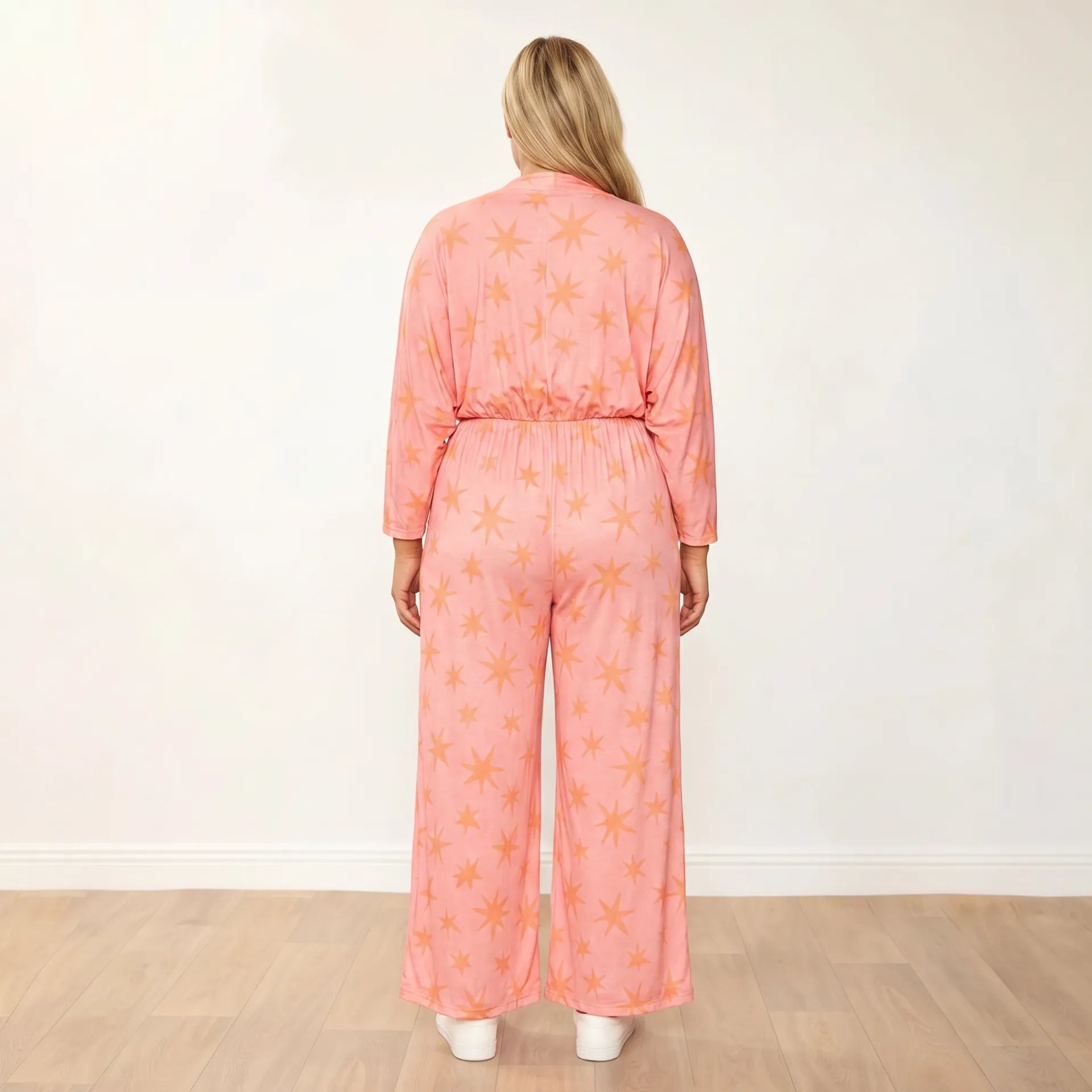 Vogue Jumpsuit Peach Star - Plus Size Model XXL - Front hands in pockets confident