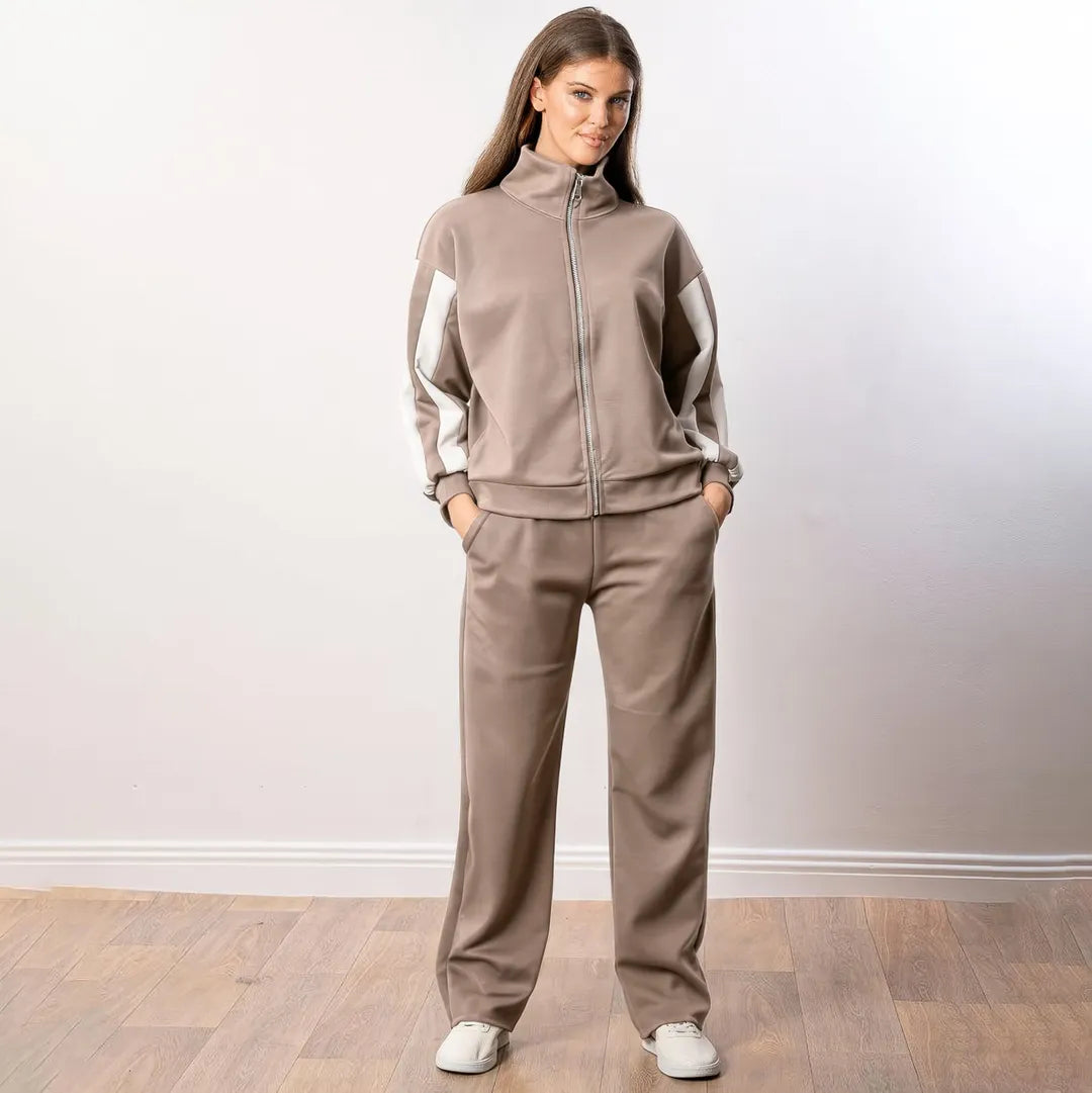 Aubree Co-ord in taupe — front view, hands in pockets, zip-through top and wide-leg trousers