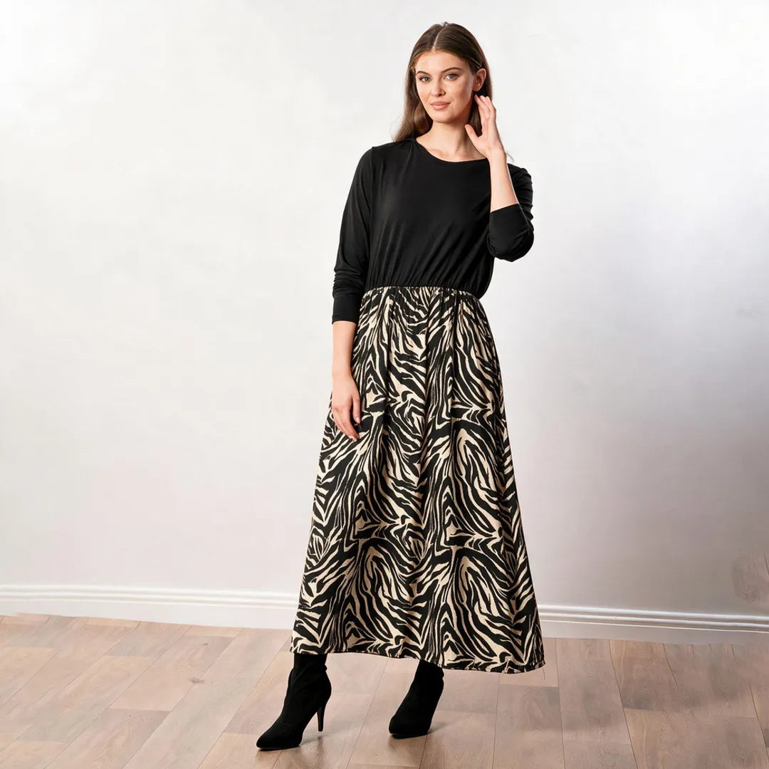 Audrey Dress in black and cream zebra print — three-quarter view showing skirt drape and elastic waist