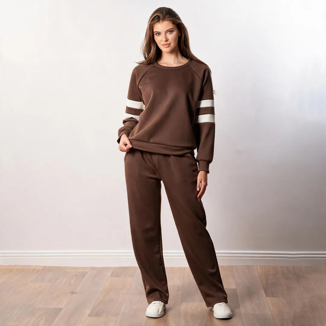 Jasmine Stripe Co-ord in brown, cheerful front view with white trainers