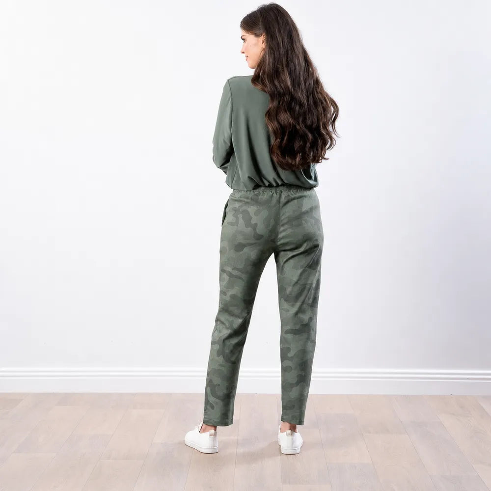 Back view of the Stella Jogger in army camo print with elasticated waistband and white trainers