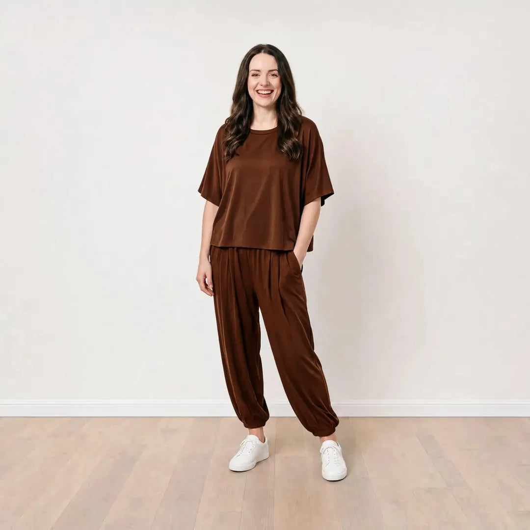 Róisín wearing the Orla Co-Ord in Chocolate Brown with one hand in the trouser pocket