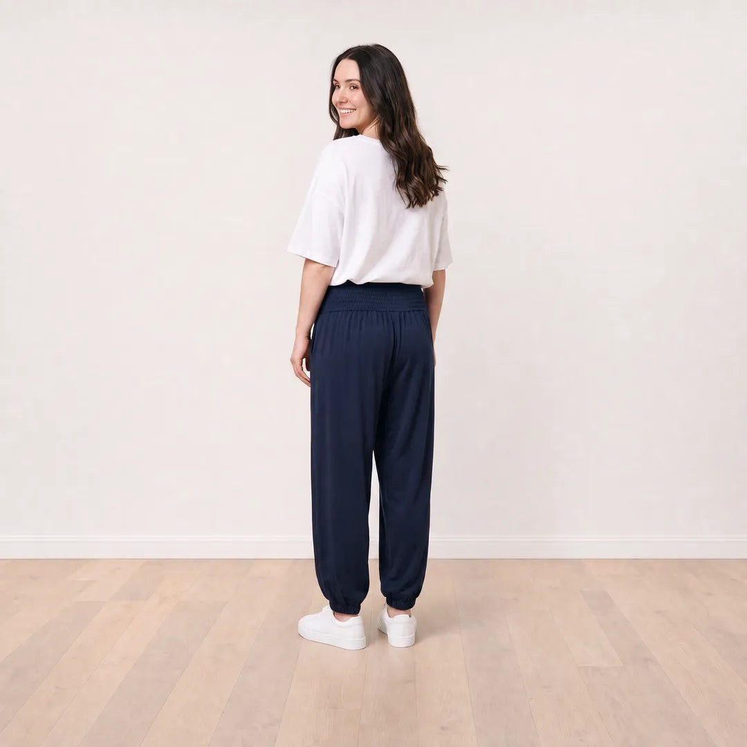 Orla Trousers in navy on T_Róisín, full back view with white top