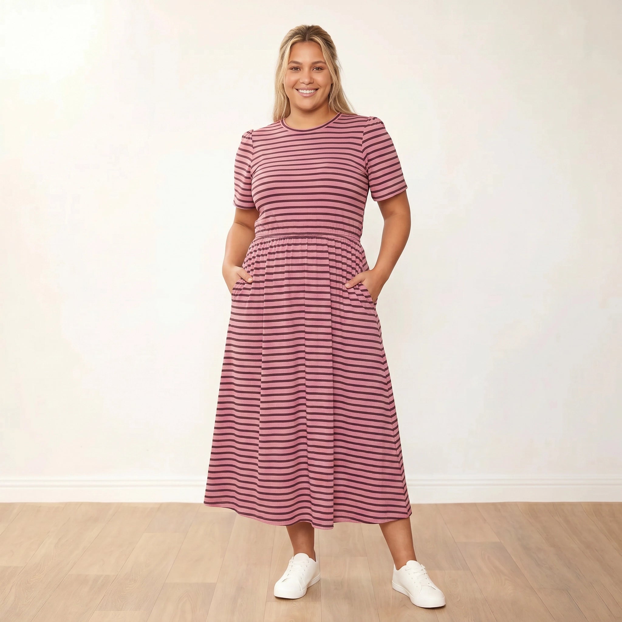 Eilish Dress (Pink/Brown) - Plus Size XXL - Front, hands in pockets, open smile