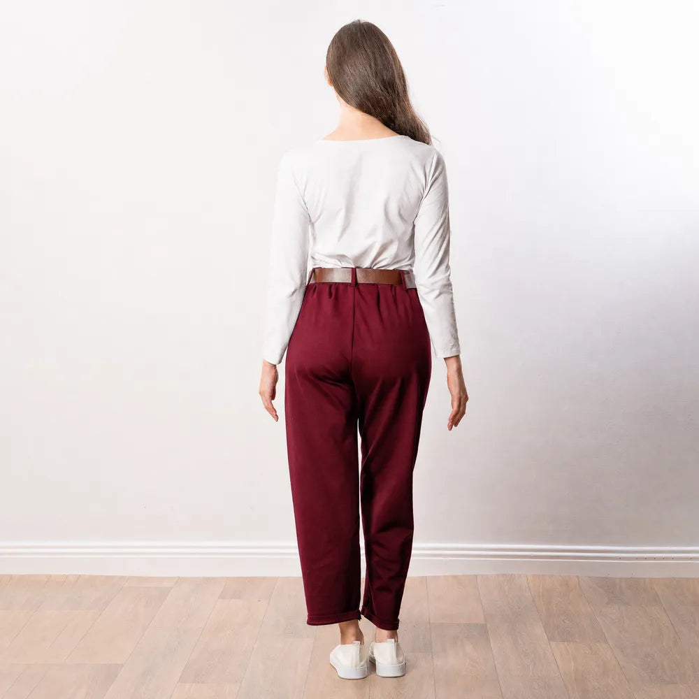 Arya Tapered Trousers in wine — back view showing rear waistband, centre back seam and turned-up hem
