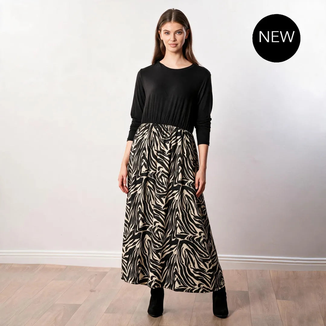 Audrey Dress in black and cream zebra print — front view with black long-sleeve bodice and black heeled boots