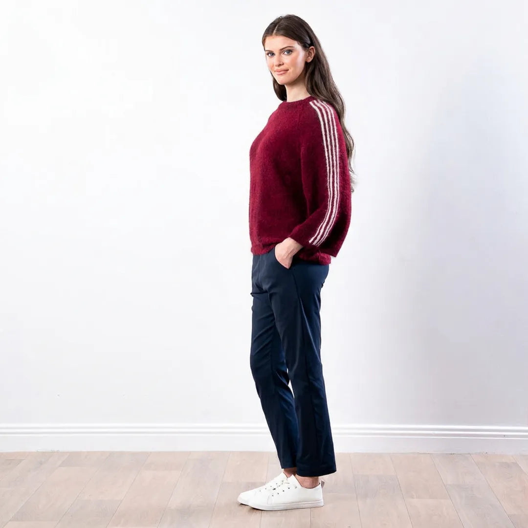 Debbie Knit Jumper Stripe in wine, side profile view with hand in trouser pocket