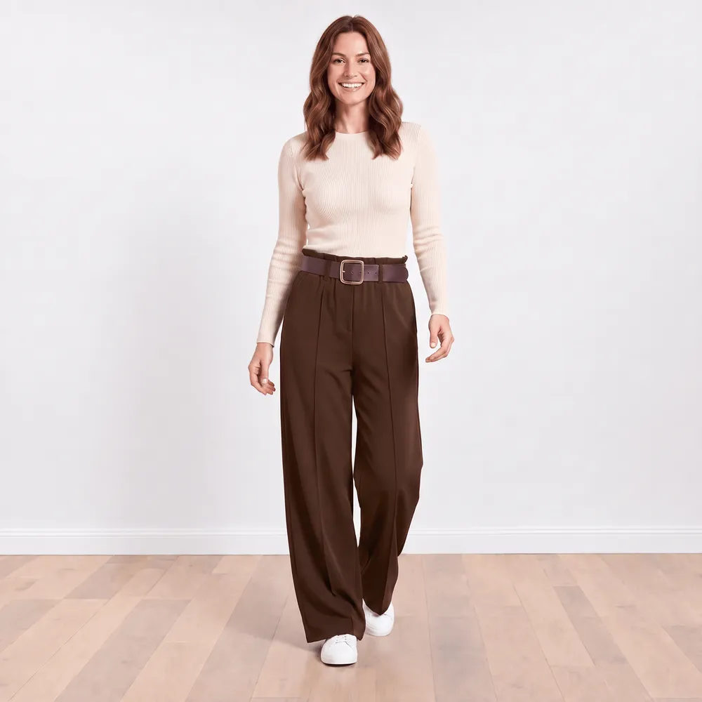 Ellana Trousers in brown — relaxed front view with cream ribbed knit top and white trainers