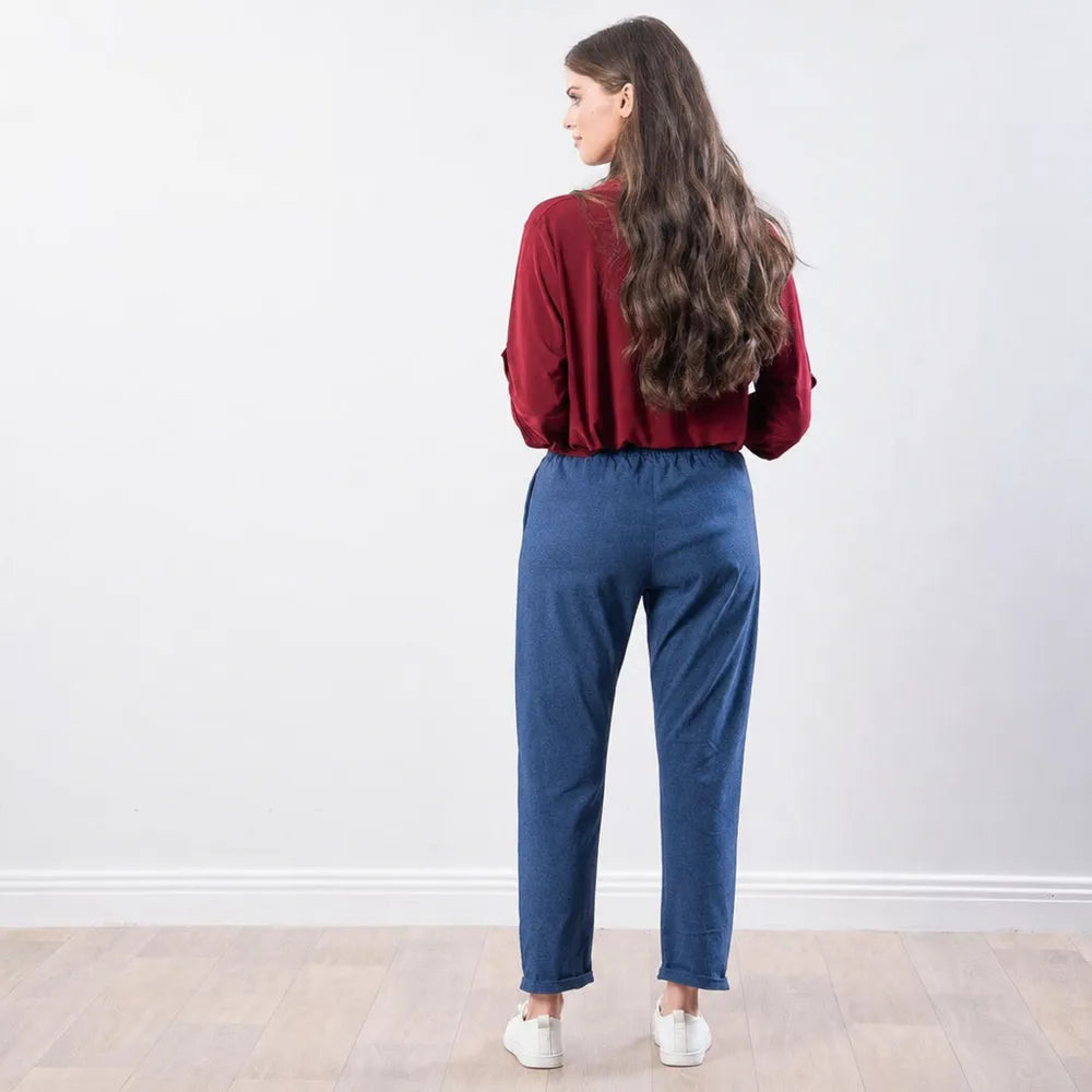 The Casual Company Stella Jogger in denim blue, full back view with white trainers