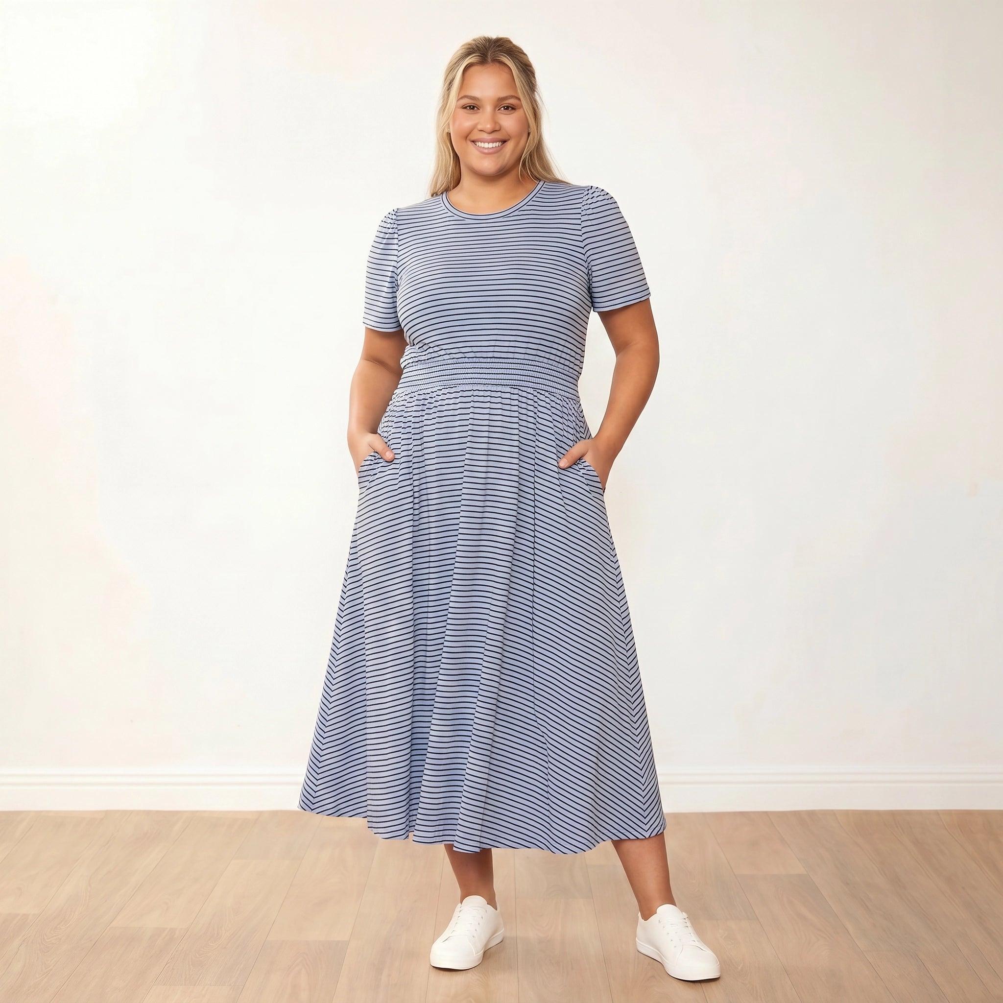 Eilish Dress (Blue/Brown) - Front, smiling, hands in pockets - Plus Size