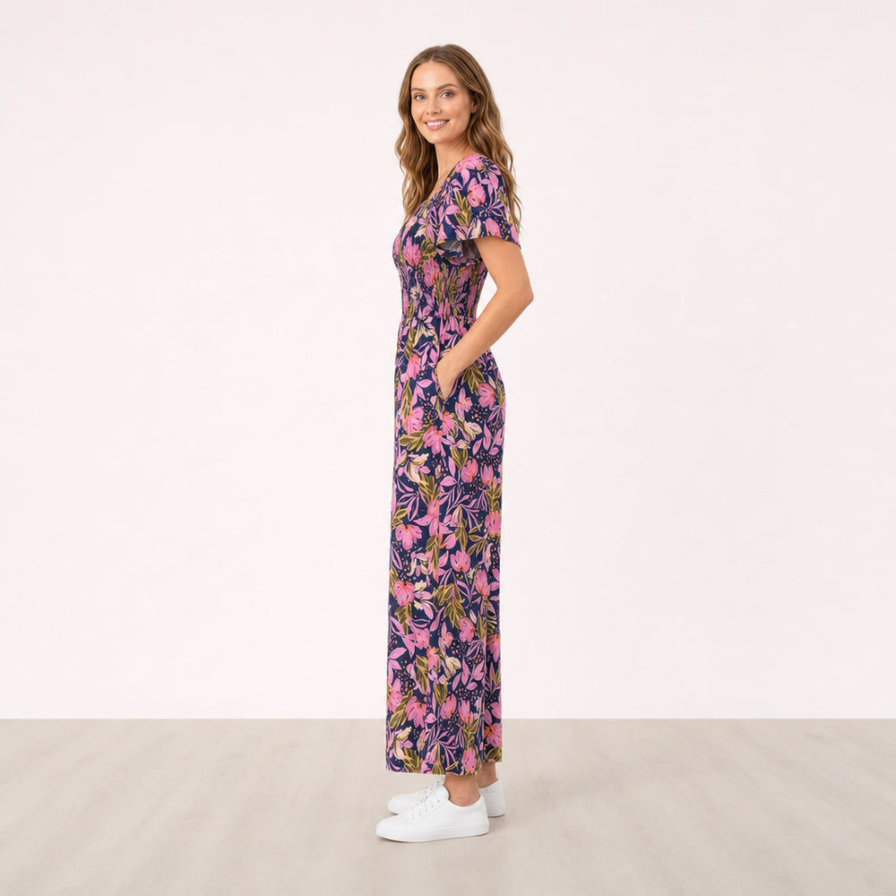 Ivan Jumpsuit Midnight Bloom Lavender on Alva - side view with hand in pocket