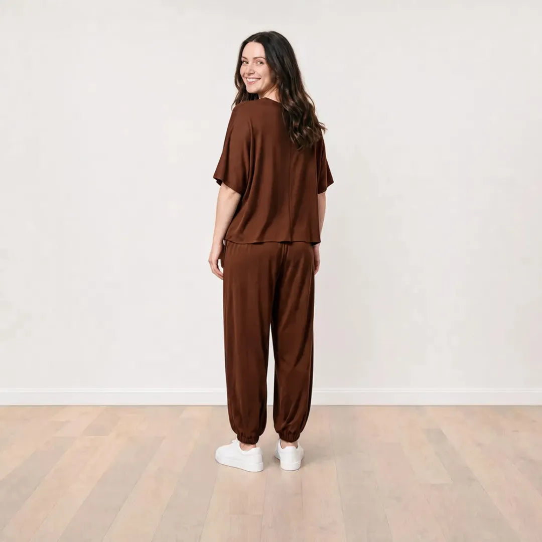 Róisín wearing the Orla Co-Ord in Chocolate Brown, smiling full back view