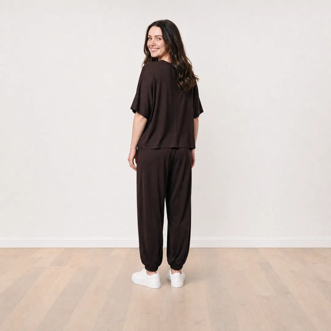 Róisín wearing the Orla Co-Ord in Chocolate Brown, smiling full back view