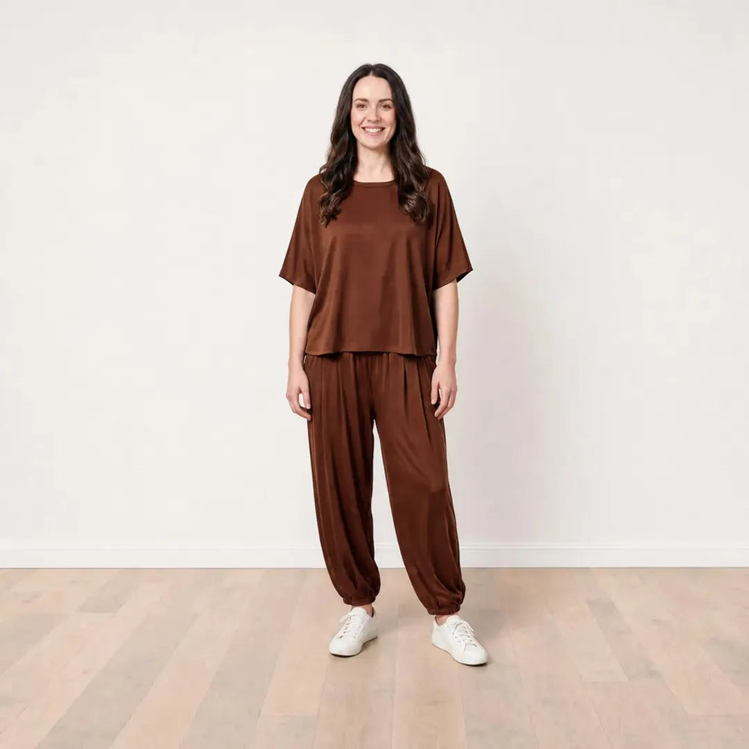Róisín wearing the Orla Co-Ord in Chocolate Brown, cheerful full front view