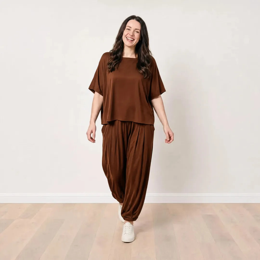 Róisín wearing the Orla Co-Ord in Chocolate Brown in a cheerful relaxed walking pose