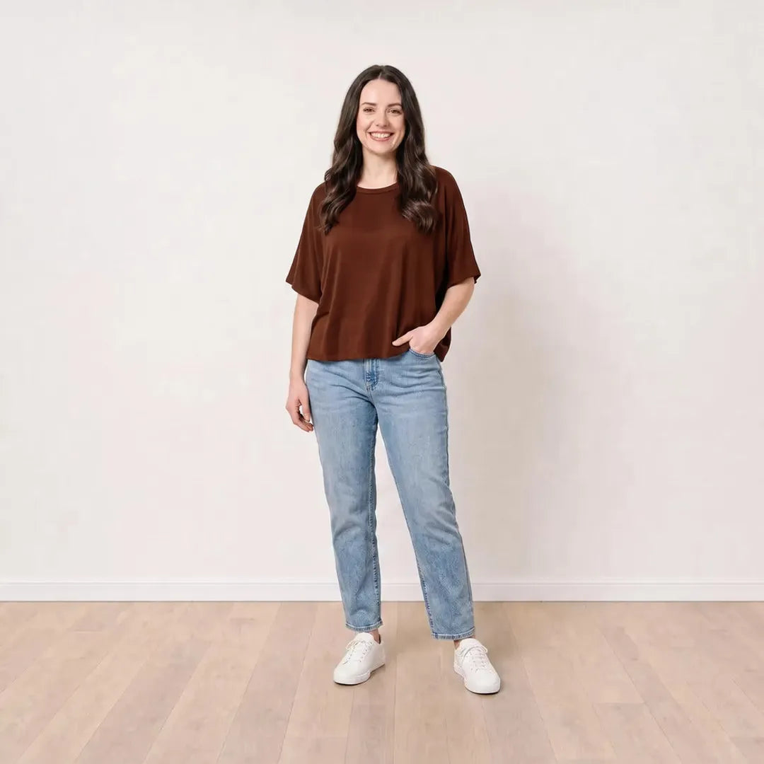 Orla Top in chocolate brown styled with light-wash straight-leg jeans, relaxed pocket pose