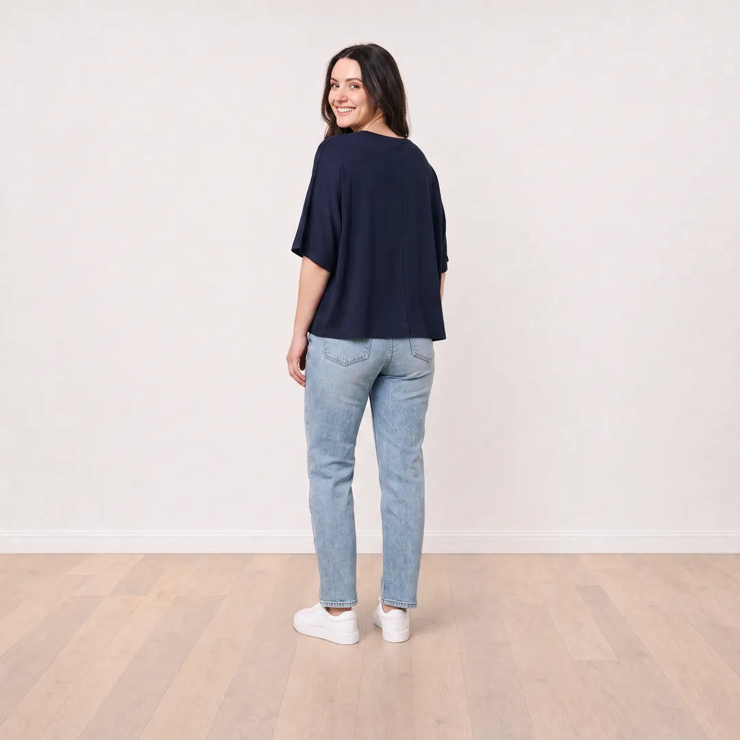 Orla Top in navy styled with light-wash straight-leg jeans — back view