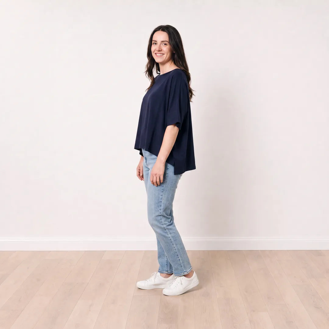 Orla Top in navy styled with light-wash straight-leg jeans — side view